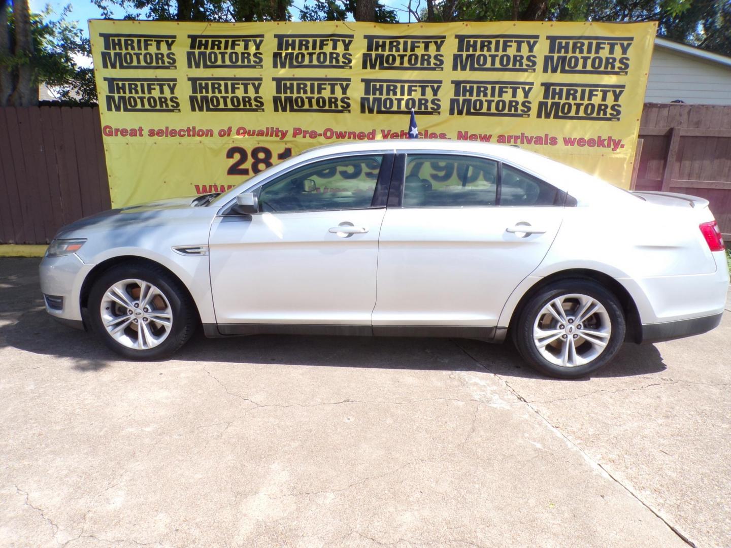 2015 Ford Taurus SEL FWD (1FAHP2E98FG) with an 2.0L L4 DOHC 16V engine, 6-Speed Automatic transmission, located at 16710 Clay Rd., Houston, TX, 77084, (281) 859-7900, 29.834864, -95.656166 - Photo#0