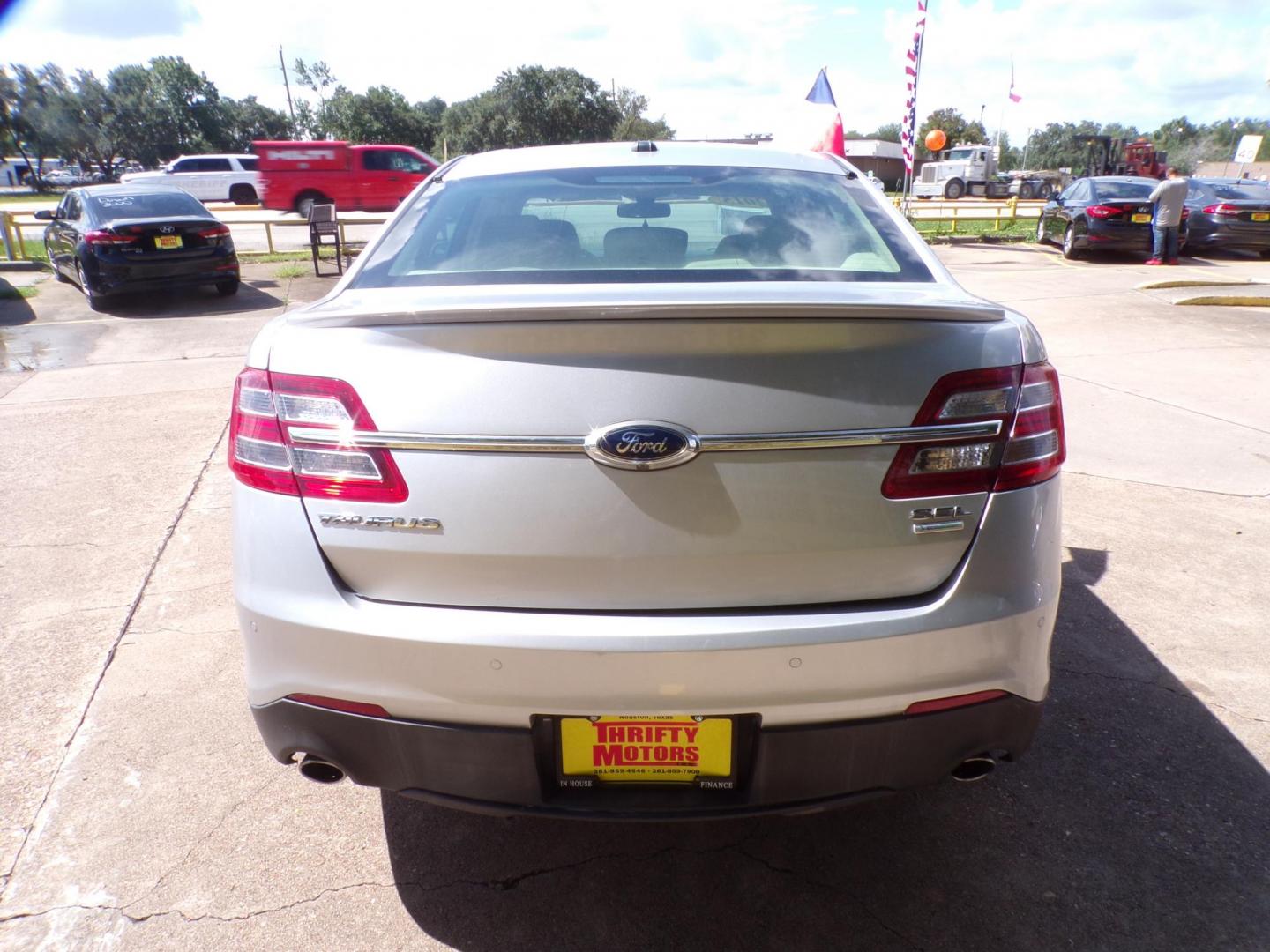 2015 Ford Taurus SEL FWD (1FAHP2E98FG) with an 2.0L L4 DOHC 16V engine, 6-Speed Automatic transmission, located at 16710 Clay Rd., Houston, TX, 77084, (281) 859-7900, 29.834864, -95.656166 - Photo#5