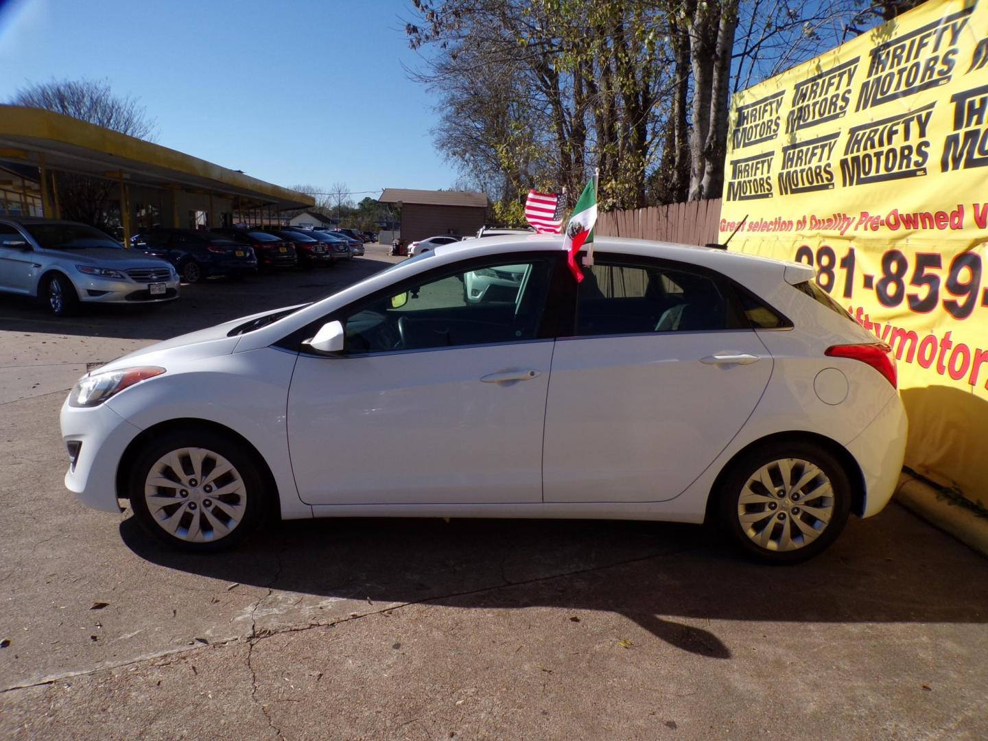 2017 White /Black Hyundai Elantra GT M/T (KMHD35LH7HU) with an 2.0L L4 16V DOHC engine, 6M transmission, located at 16710 Clay Rd., Houston, TX, 77084, (281) 859-7900, 29.834864, -95.656166 - Photo#4