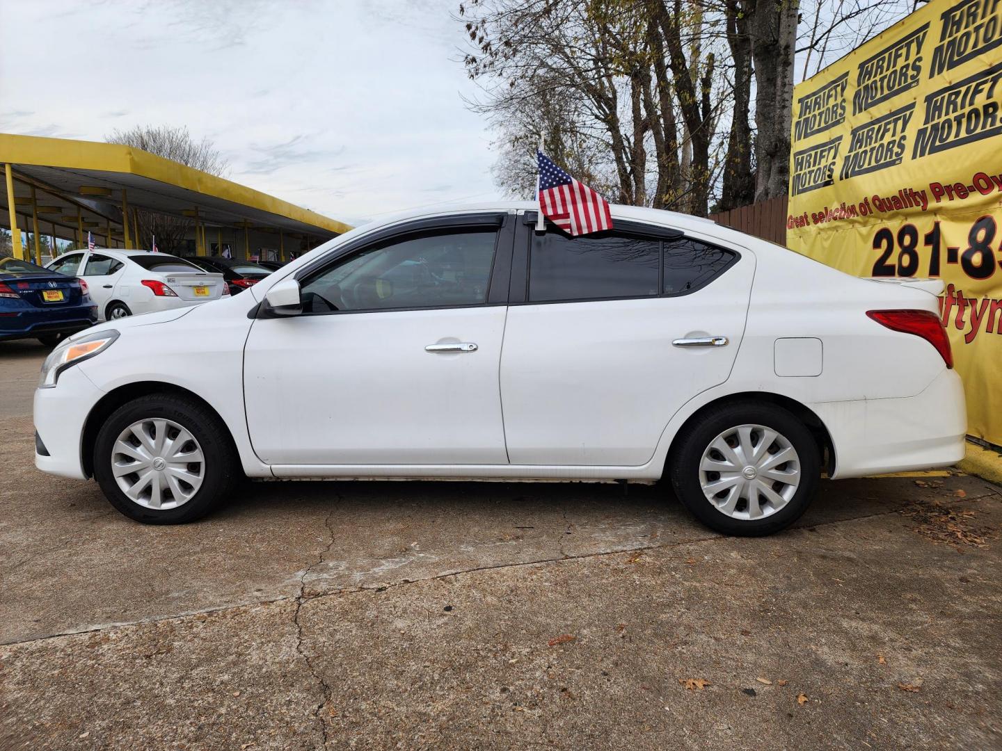 2019 White /Black Nissan Versa 1.6 SV Sedan (3N1CN7AP0KL) with an 1.6L L4 DOHC 16V engine, CVT transmission, located at 16710 Clay Rd., Houston, TX, 77084, (281) 859-7900, 29.834864, -95.656166 - Photo#4