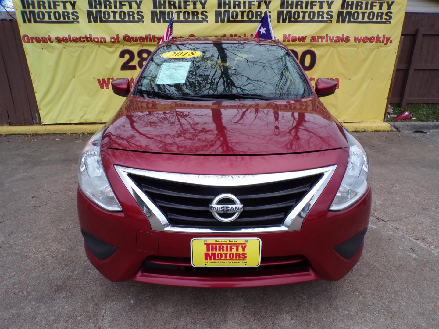 2018 Red /Gray Nissan Versa 1.6 SL Sedan (3N1CN7AP5JL) with an 1.6L L4 DOHC 16V engine, CVT transmission, located at 16710 Clay Rd., Houston, TX, 77084, (281) 859-7900, 29.834864, -95.656166 - Photo#0