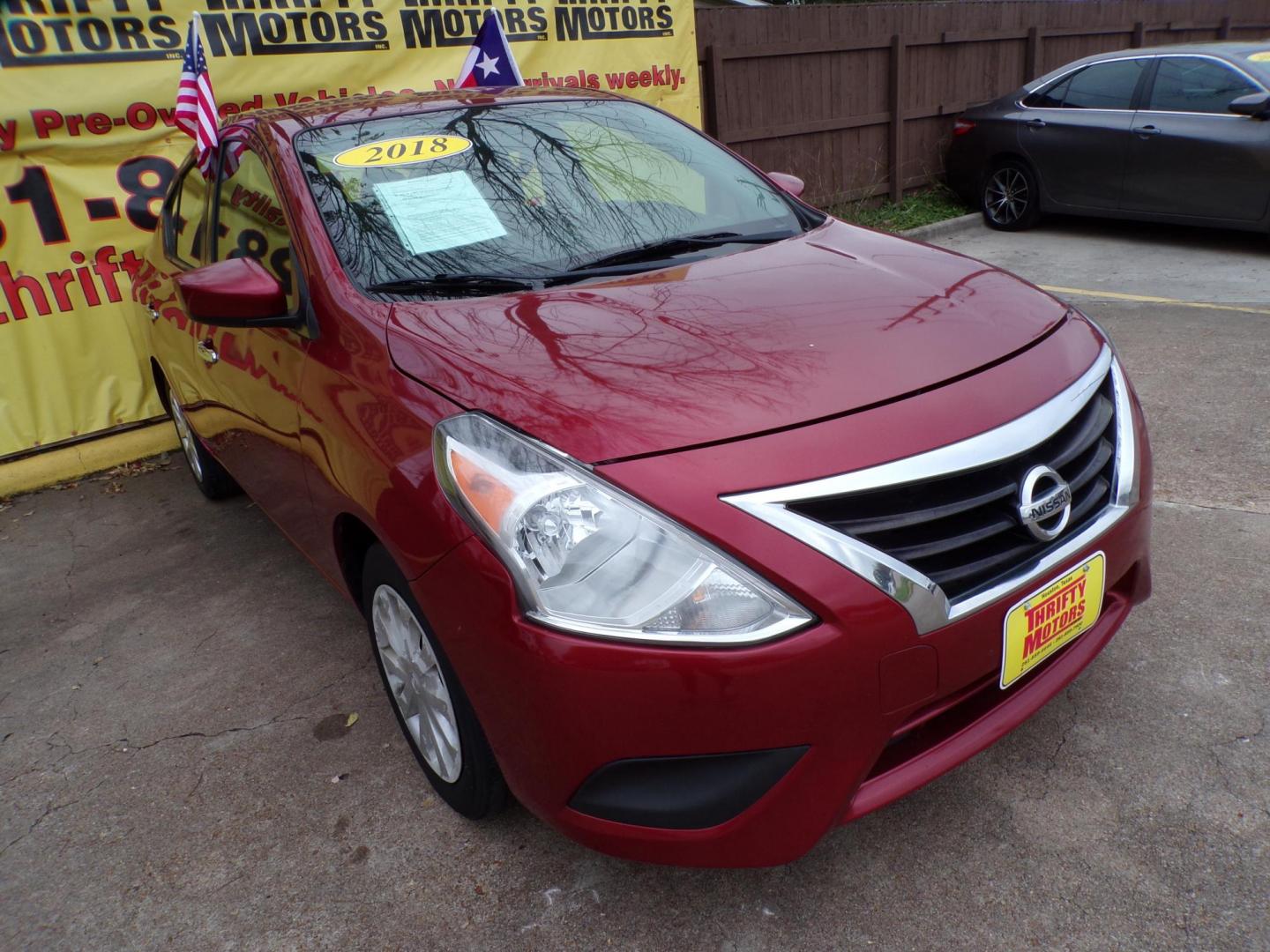 2018 Red /Gray Nissan Versa 1.6 SL Sedan (3N1CN7AP5JL) with an 1.6L L4 DOHC 16V engine, CVT transmission, located at 16710 Clay Rd., Houston, TX, 77084, (281) 859-7900, 29.834864, -95.656166 - Photo#1