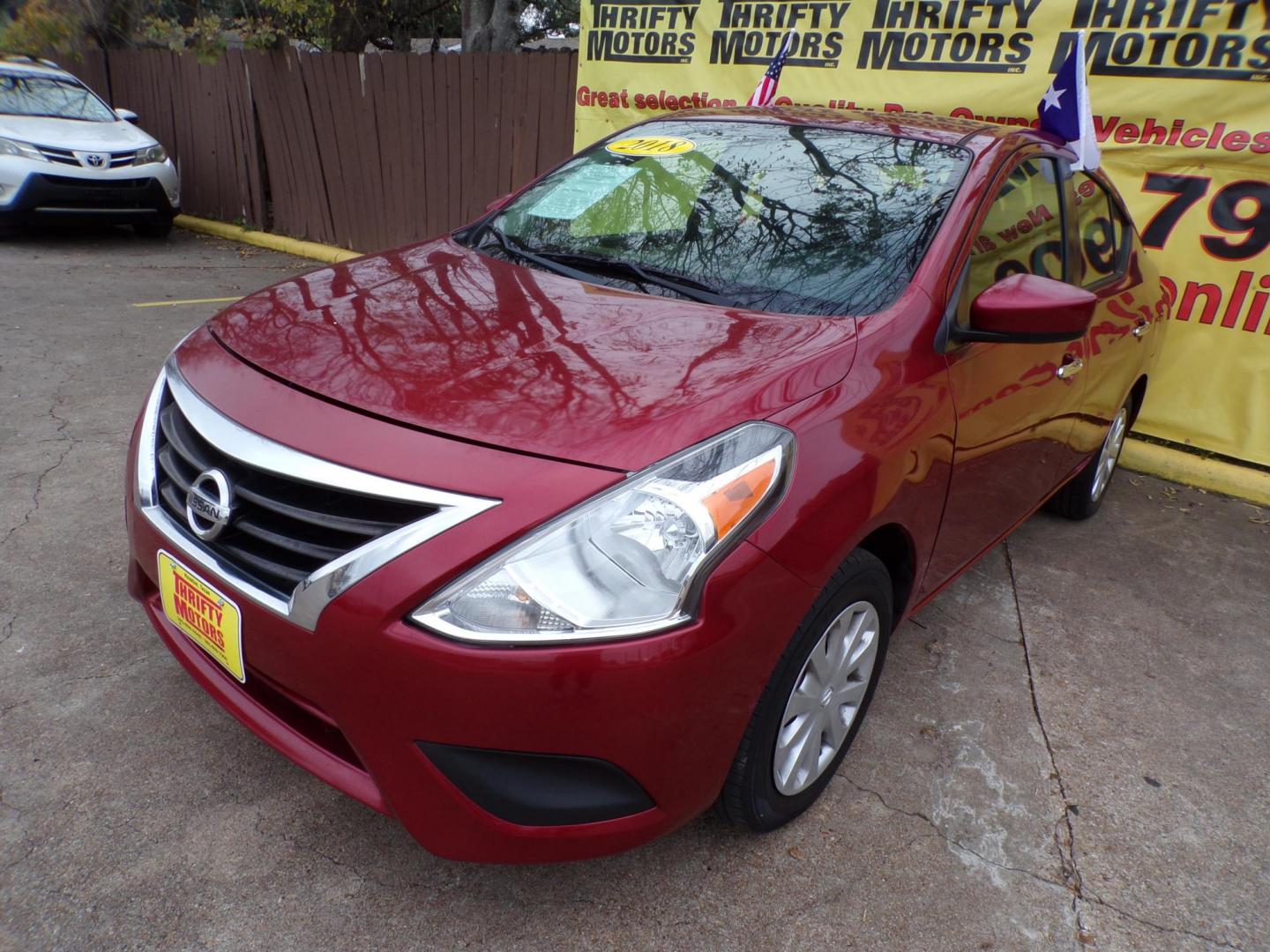 2018 Red /Gray Nissan Versa 1.6 SL Sedan (3N1CN7AP5JL) with an 1.6L L4 DOHC 16V engine, CVT transmission, located at 16710 Clay Rd., Houston, TX, 77084, (281) 859-7900, 29.834864, -95.656166 - Photo#2