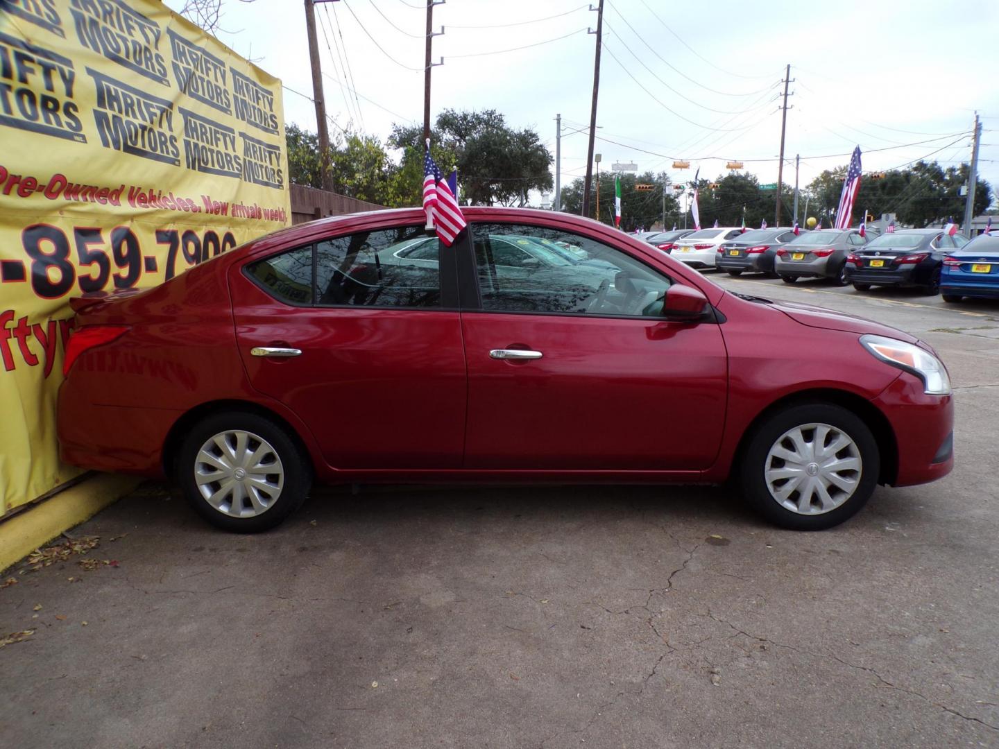 2018 Red /Gray Nissan Versa 1.6 SL Sedan (3N1CN7AP5JL) with an 1.6L L4 DOHC 16V engine, CVT transmission, located at 16710 Clay Rd., Houston, TX, 77084, (281) 859-7900, 29.834864, -95.656166 - Photo#4