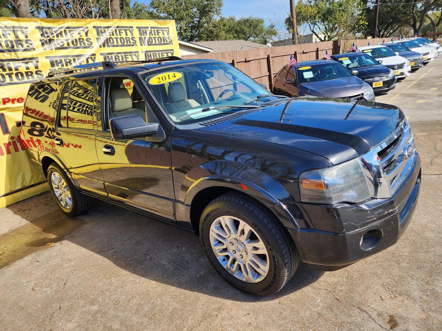 2014 Black /Tan Ford Expedition Limited 2WD (1FMJU1K58EE) with an 5.4L V8 SOHC 16V FFV engine, 6-Speed Automatic transmission, located at 16710 Clay Rd., Houston, TX, 77084, (281) 859-7900, 29.834864, -95.656166 - Photo#2