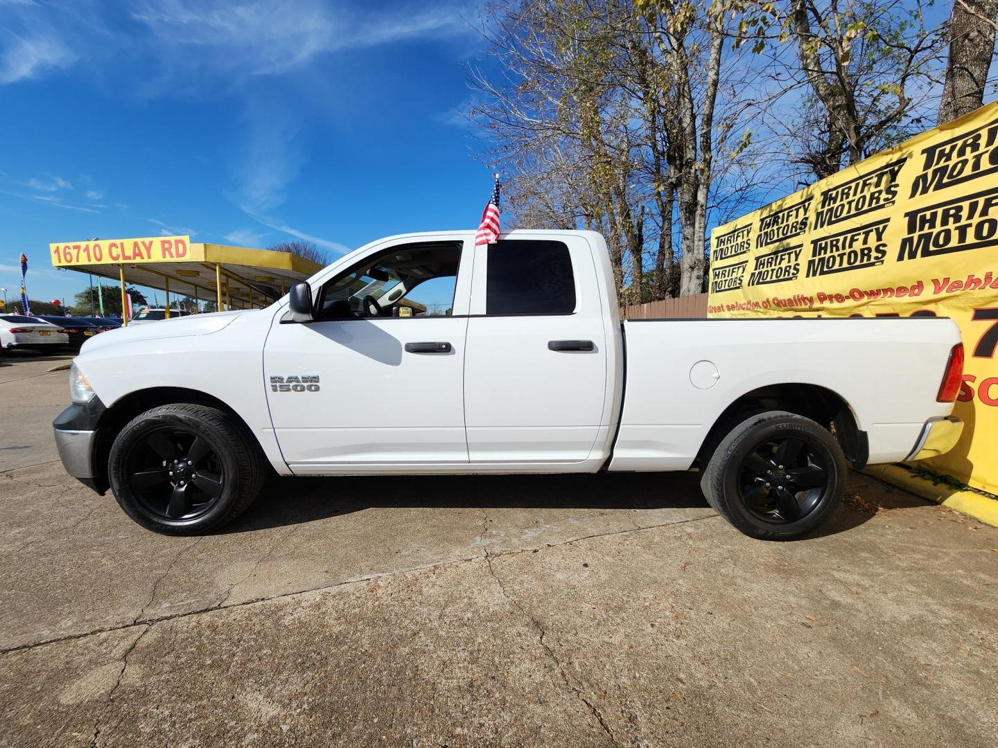 2018 White /Gray RAM 1500 Tradesman Quad Cab 2WD (1C6RR6FG7JS) with an 3.6L V6 DOHC 24V FFV engine, 8A transmission, located at 16710 Clay Rd., Houston, TX, 77084, (281) 859-7900, 29.834864, -95.656166 - Photo#4