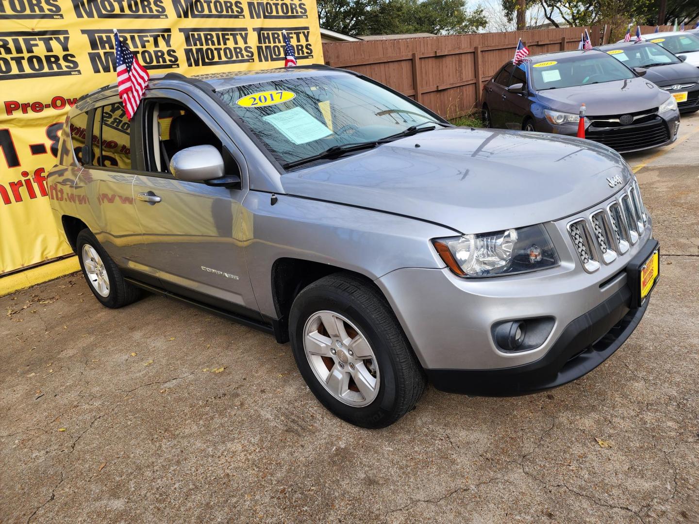 2017 Gray /Gray Jeep Compass Latitude FWD (1C4NJCEA8HD) with an 2.0L L4 DOHC 16V engine, Automatic transmission, located at 16710 Clay Rd., Houston, TX, 77084, (281) 859-7900, 29.834864, -95.656166 - Photo#2