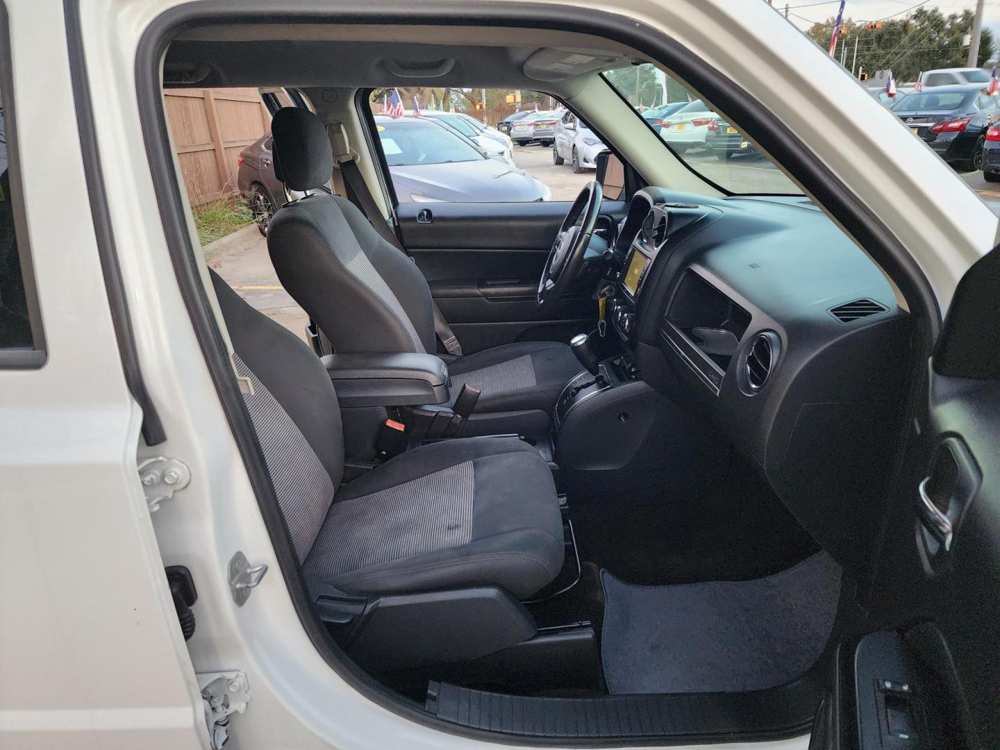 2016 White /Gray Jeep Patriot Latitude 2WD (1C4NJPFBXGD) with an 2.4L L4 DOHC 16V engine, located at 16710 Clay Rd., Houston, TX, 77084, (281) 859-7900, 29.834864, -95.656166 - Photo#8