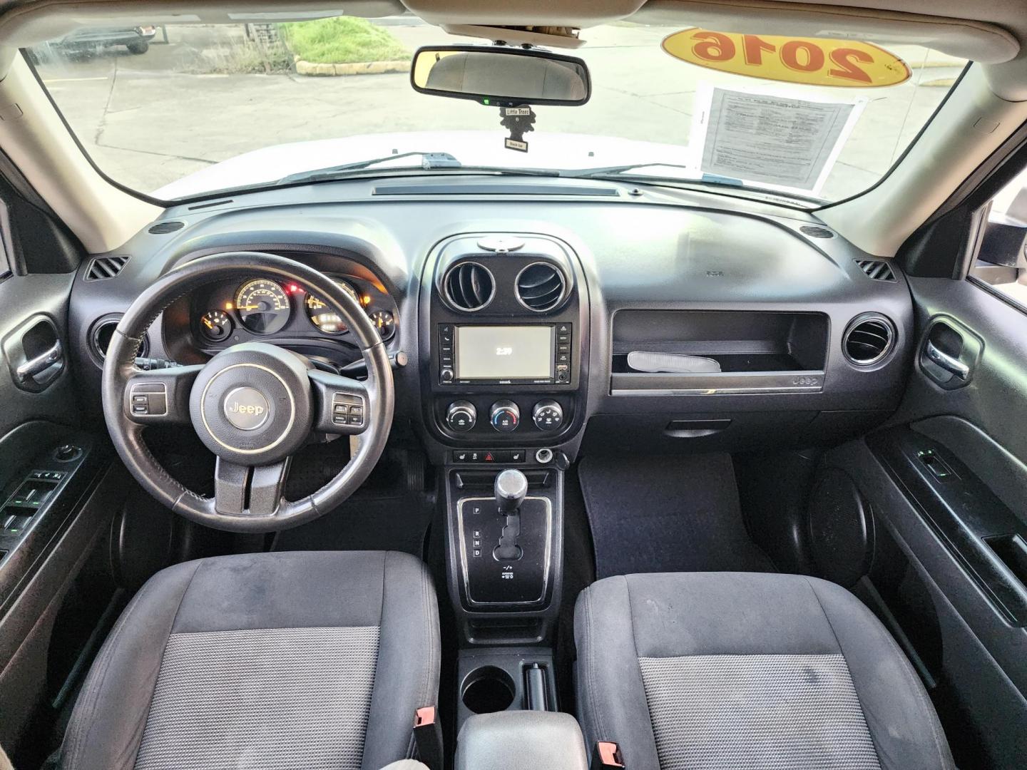 2016 White /Gray Jeep Patriot Latitude 2WD (1C4NJPFBXGD) with an 2.4L L4 DOHC 16V engine, located at 16710 Clay Rd., Houston, TX, 77084, (281) 859-7900, 29.834864, -95.656166 - Photo#11