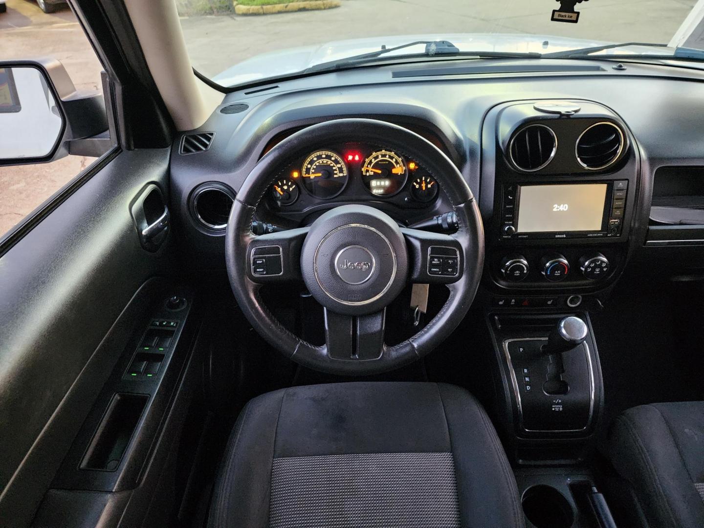 2016 White /Gray Jeep Patriot Latitude 2WD (1C4NJPFBXGD) with an 2.4L L4 DOHC 16V engine, located at 16710 Clay Rd., Houston, TX, 77084, (281) 859-7900, 29.834864, -95.656166 - Photo#13