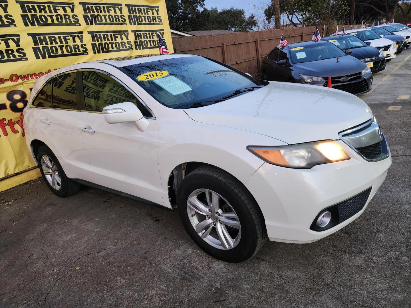 2015 White /Beige Acura RDX 6-Spd AT w/ Technology Package (5J8TB3H55FL) with an 2.3L L4 DOHC 16V engine, 6-Speed Automatic transmission, located at 16710 Clay Rd., Houston, TX, 77084, (281) 859-7900, 29.834864, -95.656166 - Photo#2