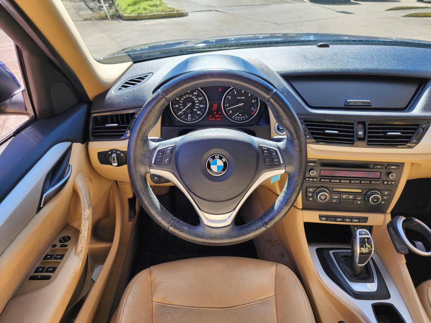 2013 Blue /Beige BMW X1 xDrive28i (WBAVL1C53DV) with an 2.0L L4 DOHC 16V engine, 8-Speed Automatic transmission, located at 16710 Clay Rd., Houston, TX, 77084, (281) 859-7900, 29.834864, -95.656166 - Photo#6