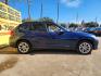 2013 Blue /Beige BMW X1 xDrive28i (WBAVL1C53DV) with an 2.0L L4 DOHC 16V engine, 8-Speed Automatic transmission, located at 16710 Clay Rd., Houston, TX, 77084, (281) 859-7900, 29.834864, -95.656166 - Photo#3