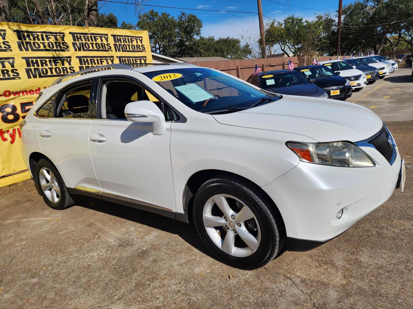 2012 White /Black Lexus RX 350 AWD (JTJBK1BAXC2) with an 3.5L V6 DOHC 24V engine, 5-Speed Automatic transmission, located at 16710 Clay Rd., Houston, TX, 77084, (281) 859-7900, 29.834864, -95.656166 - Photo#2