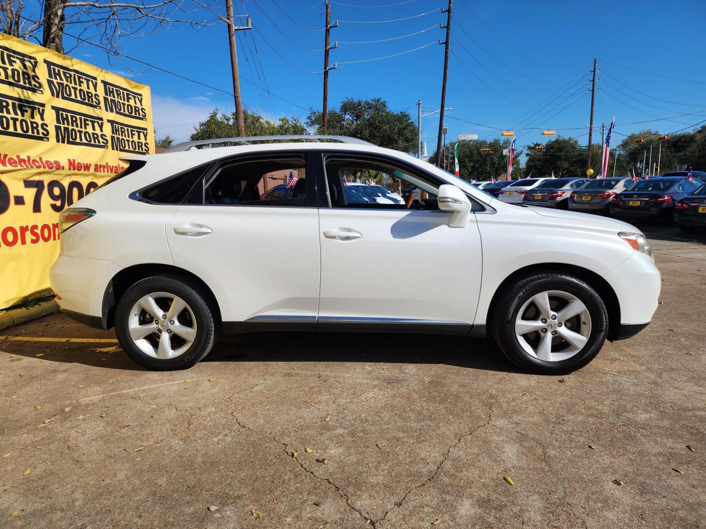 2012 White /Black Lexus RX 350 AWD (JTJBK1BAXC2) with an 3.5L V6 DOHC 24V engine, 5-Speed Automatic transmission, located at 16710 Clay Rd., Houston, TX, 77084, (281) 859-7900, 29.834864, -95.656166 - Photo#3