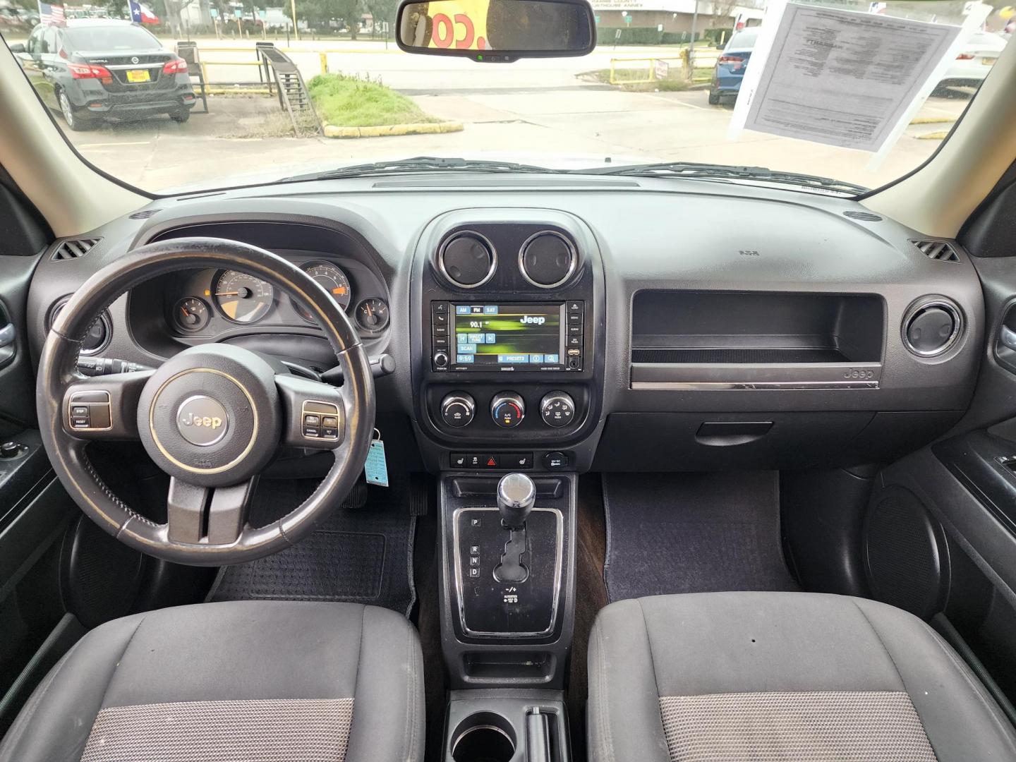 2014 Silver /Gray Jeep Patriot Latitude 2WD (1C4NJPFA0ED) with an 2.0L L4 DOHC 16V engine, located at 16710 Clay Rd., Houston, TX, 77084, (281) 859-7900, 29.834864, -95.656166 - Photo#9