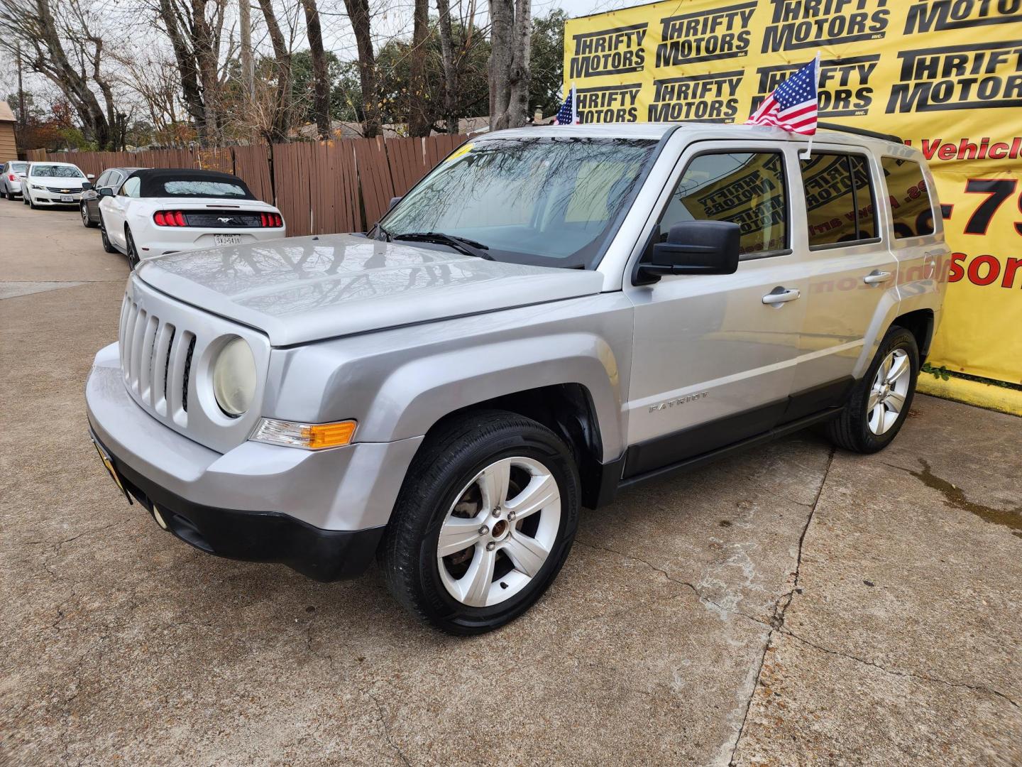 2014 Silver /Gray Jeep Patriot Latitude 2WD (1C4NJPFA0ED) with an 2.0L L4 DOHC 16V engine, located at 16710 Clay Rd., Houston, TX, 77084, (281) 859-7900, 29.834864, -95.656166 - Photo#1