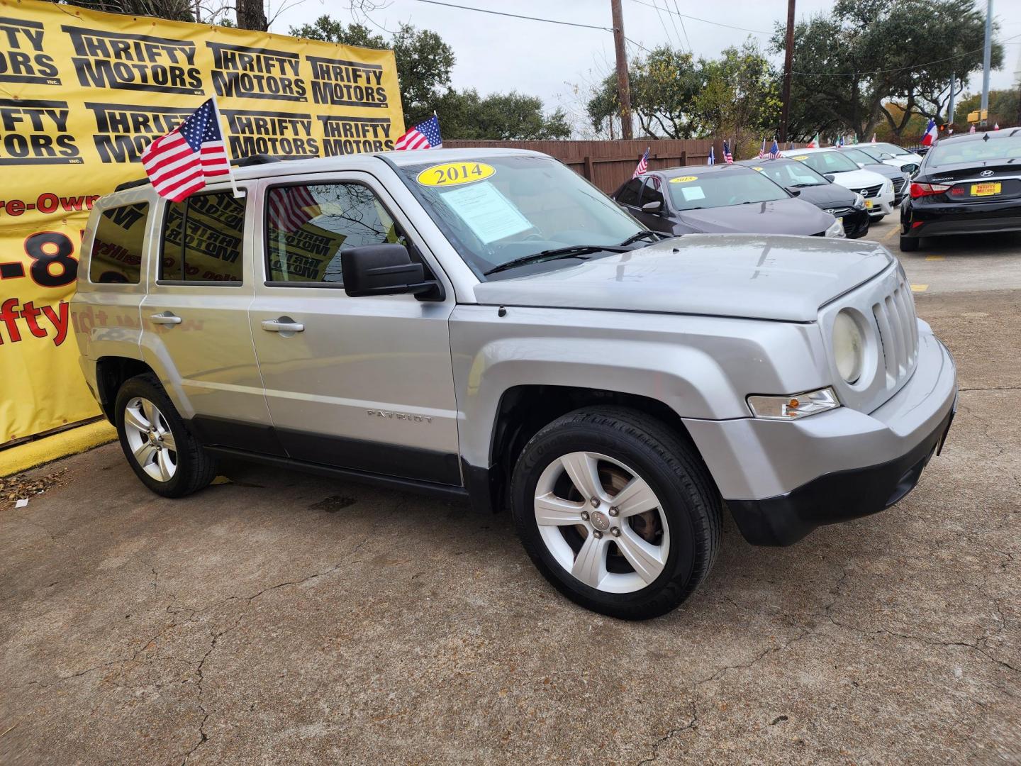 2014 Silver /Gray Jeep Patriot Latitude 2WD (1C4NJPFA0ED) with an 2.0L L4 DOHC 16V engine, located at 16710 Clay Rd., Houston, TX, 77084, (281) 859-7900, 29.834864, -95.656166 - Photo#2