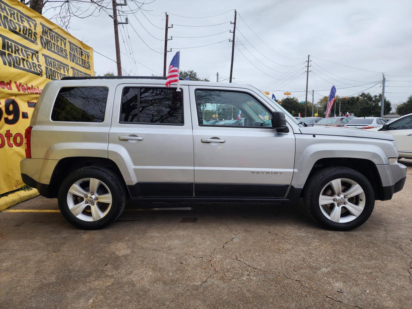 2014 Silver /Gray Jeep Patriot Latitude 2WD (1C4NJPFA0ED) with an 2.0L L4 DOHC 16V engine, located at 16710 Clay Rd., Houston, TX, 77084, (281) 859-7900, 29.834864, -95.656166 - Photo#3