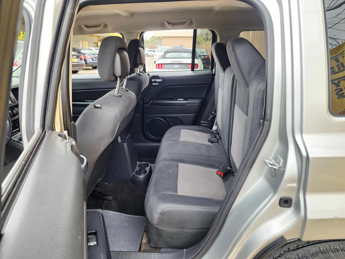 2014 Silver /Gray Jeep Patriot Latitude 2WD (1C4NJPFA0ED) with an 2.0L L4 DOHC 16V engine, located at 16710 Clay Rd., Houston, TX, 77084, (281) 859-7900, 29.834864, -95.656166 - Photo#12