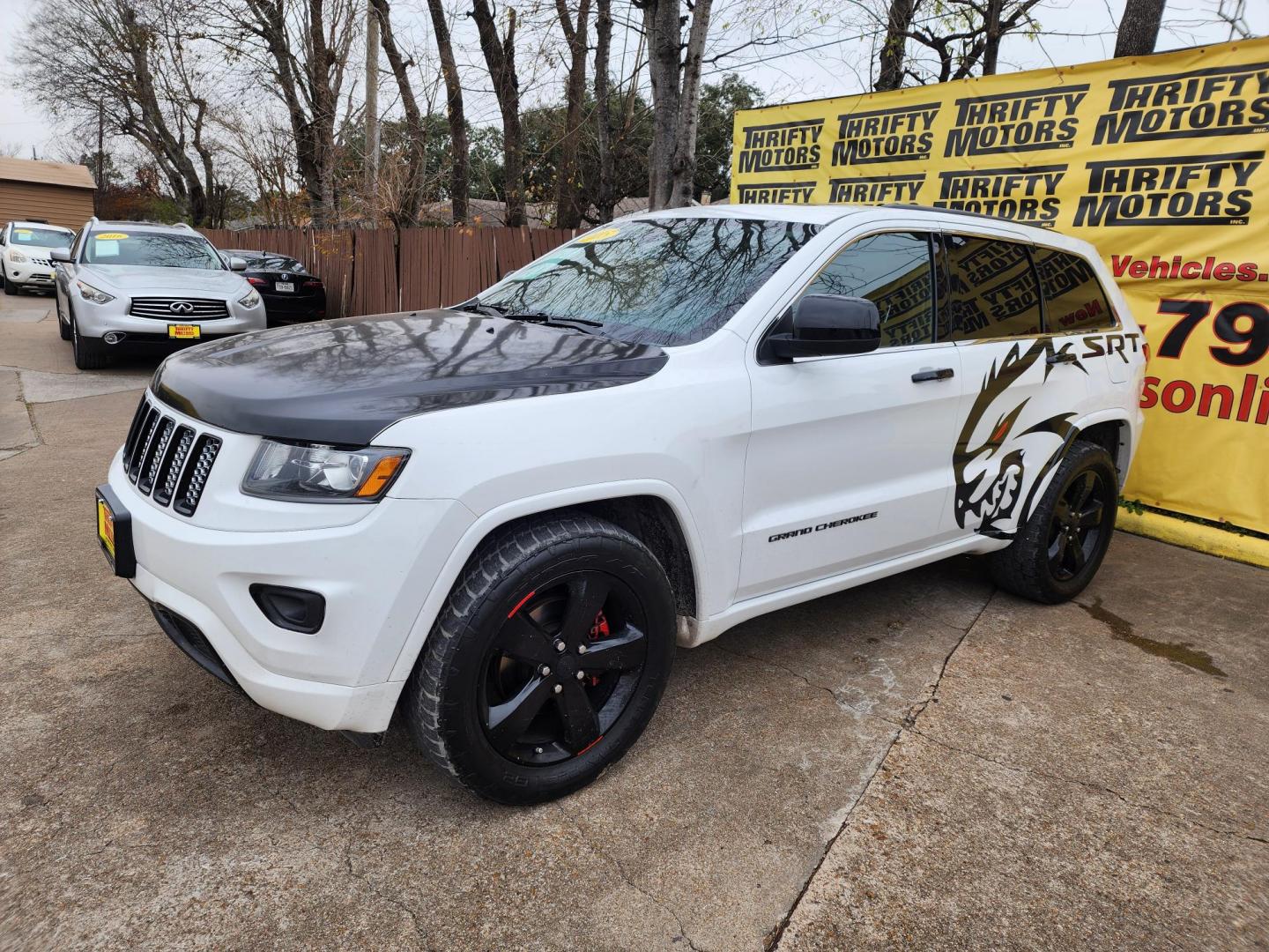 2015 White /Black Jeep Grand Cherokee Laredo 4WD (1C4RJFAG3FC) with an 3.6L V6 DOHC 24V engine, 8-Speed Automatic transmission, located at 16710 Clay Rd., Houston, TX, 77084, (281) 859-7900, 29.834864, -95.656166 - Photo#1