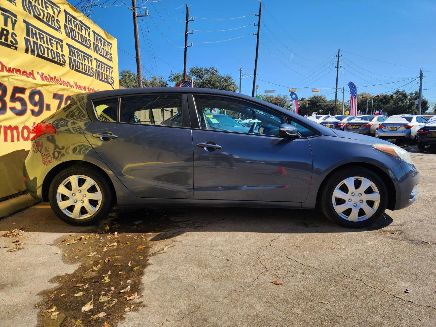 2016 Blue /Gray Kia Forte 5-Door LX (KNAFK5A80G5) with an 2.0L L4 DOHC 16V engine, Automatic 6-Speed transmission, located at 16710 Clay Rd., Houston, TX, 77084, (281) 859-7900, 29.834864, -95.656166 - Photo#3