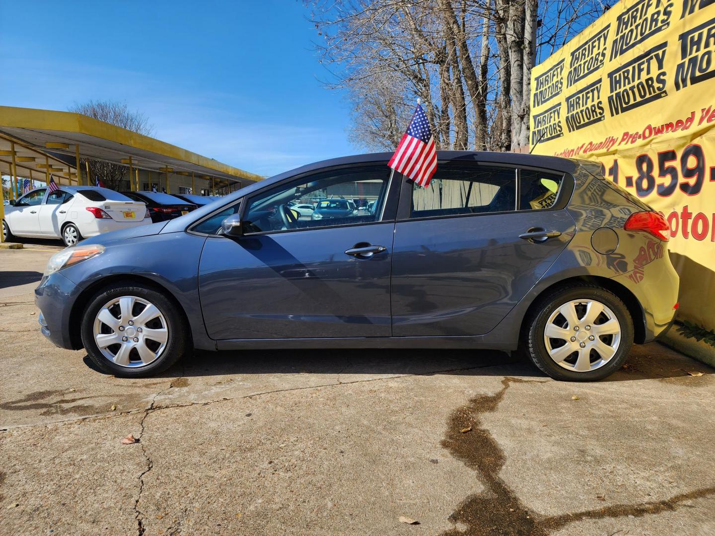 2016 Blue /Gray Kia Forte 5-Door LX (KNAFK5A80G5) with an 2.0L L4 DOHC 16V engine, Automatic 6-Speed transmission, located at 16710 Clay Rd., Houston, TX, 77084, (281) 859-7900, 29.834864, -95.656166 - Photo#4