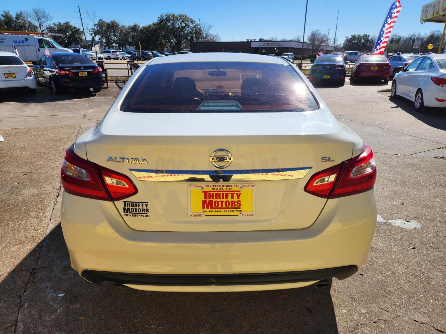 2016 White /Black Nissan Altima 2.5 SL (1N4AL3AP4GN) with an 2.5L L4 DOHC 16V engine, CVT transmission, located at 16710 Clay Rd., Houston, TX, 77084, (281) 859-7900, 29.834864, -95.656166 - Photo#5