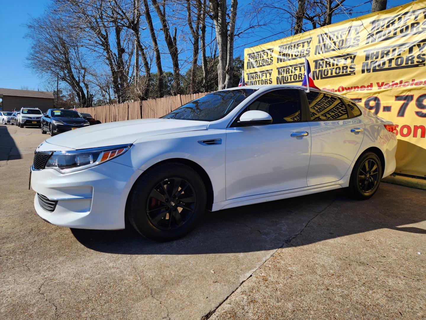 2018 White /Gray Kia Optima LX (5XXGT4L30JG) with an 2.4L L4 DOHC 16V engine, 6A transmission, located at 16710 Clay Rd., Houston, TX, 77084, (281) 859-7900, 29.834864, -95.656166 - Photo#1