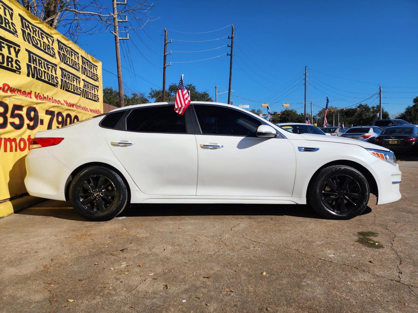 2018 White /Gray Kia Optima LX (5XXGT4L30JG) with an 2.4L L4 DOHC 16V engine, 6A transmission, located at 16710 Clay Rd., Houston, TX, 77084, (281) 859-7900, 29.834864, -95.656166 - Photo#3