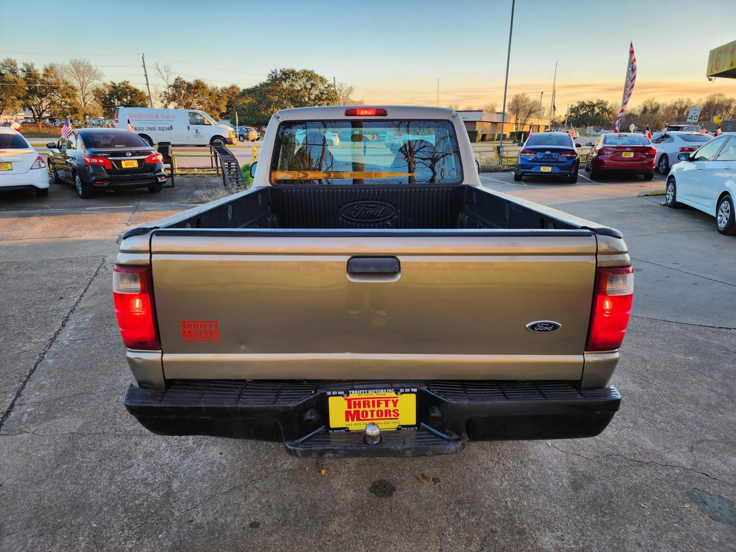 2003 Gold /Beige Ford Ranger XL Short Bed 2WD - 311A (1FTYR10D63P) with an 2.3L L4 SOHC 8V engine, Automatic 6-Speed transmission, located at 16710 Clay Rd., Houston, TX, 77084, (281) 859-7900, 29.834864, -95.656166 - Photo#5