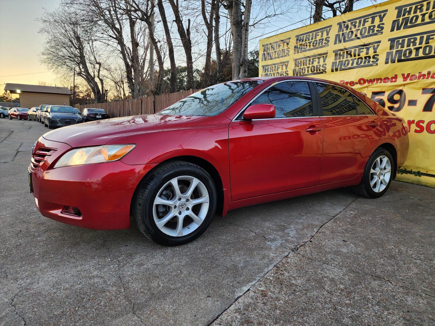 2009 Red /Gray Toyota Camry CE 5-Spd AT (4T4BE46K79R) with an 2.4L L4 DOHC 16V engine, Automatic 5-Speed transmission, located at 16710 Clay Rd., Houston, TX, 77084, (281) 859-7900, 29.834864, -95.656166 - Photo#1