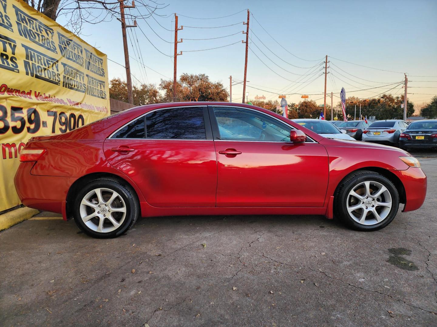 2009 Red /Gray Toyota Camry CE 5-Spd AT (4T4BE46K79R) with an 2.4L L4 DOHC 16V engine, Automatic 5-Speed transmission, located at 16710 Clay Rd., Houston, TX, 77084, (281) 859-7900, 29.834864, -95.656166 - Photo#3