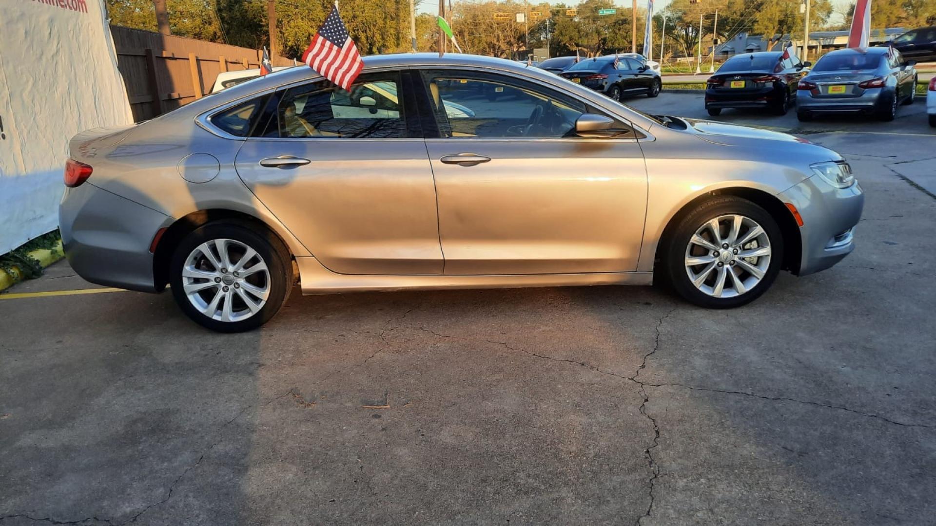 2015 Gray Chrysler 200 (1C3CCCAB5FN) with an 2.4L I4 2.4L I4 engine, Automatic 9-Speed transmission, located at 16710 Clay Rd., Houston, TX, 77084, (281) 859-7900, 29.834864, -95.656166 - Low Down. Low Payments. - Photo#3