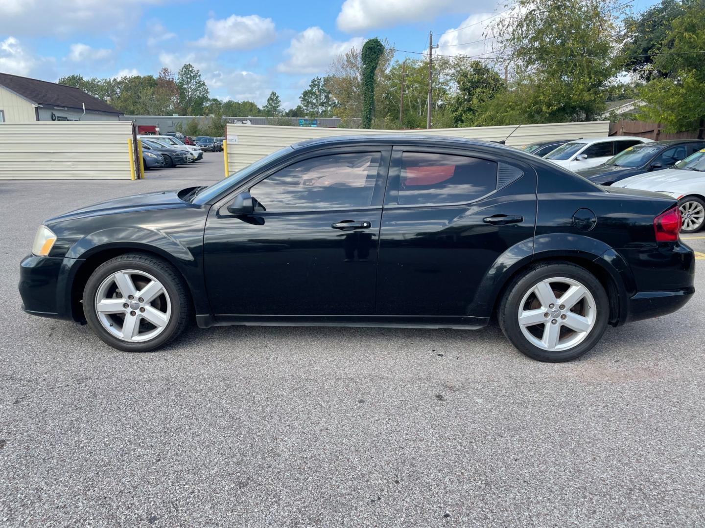 2013 Black Dodge Avenger (1C3CDZAB8DN) with an 2.4L I4 2.4L I4 engine, Automatic 4-Speed transmission, located at 16710 Clay Rd., Houston, TX, 77084, (281) 859-7900, 29.834864, -95.656166 - Photo#0