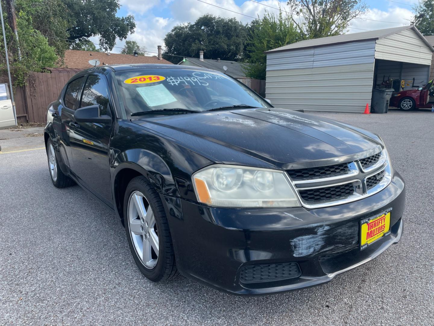 2013 Black Dodge Avenger (1C3CDZAB8DN) with an 2.4L I4 2.4L I4 engine, Automatic 4-Speed transmission, located at 16710 Clay Rd., Houston, TX, 77084, (281) 859-7900, 29.834864, -95.656166 - Photo#1