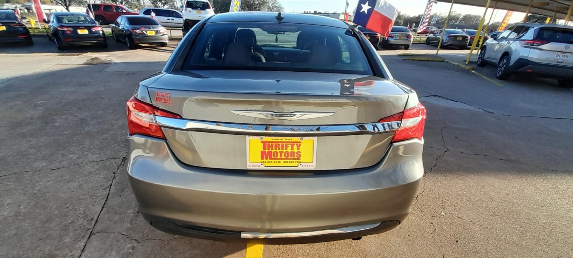 2012 Gray Chrysler 200 (1C3CCBAB1CN) with an 2.4L I4 2.4L I4 engine, Automatic 6-Speed transmission, located at 16710 Clay Rd., Houston, TX, 77084, (281) 859-7900, 29.834864, -95.656166 - Low Down. Low Payments. - Photo#5