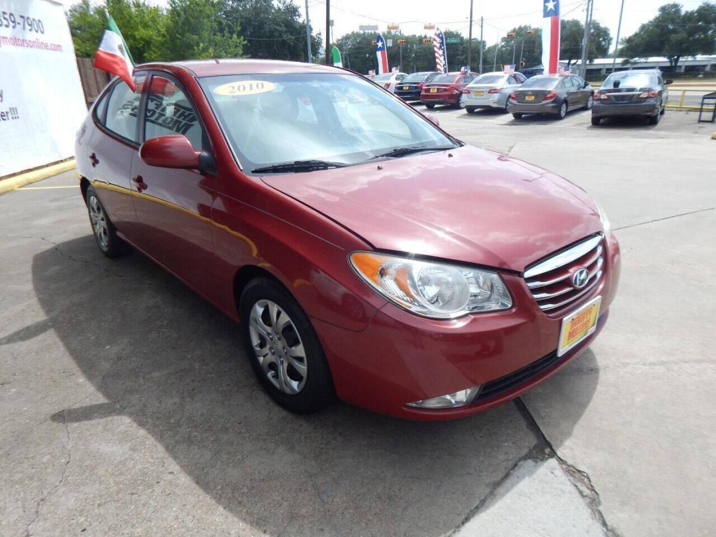 2010 Red Hyundai Elantra (KMHDU4AD7AU) with an 2.0L I4 2.0L I4 engine, Automatic 4-Speed transmission, located at 16710 Clay Rd., Houston, TX, 77084, (281) 859-7900, 29.834864, -95.656166 - Low Down. Low Payments. - Photo#2