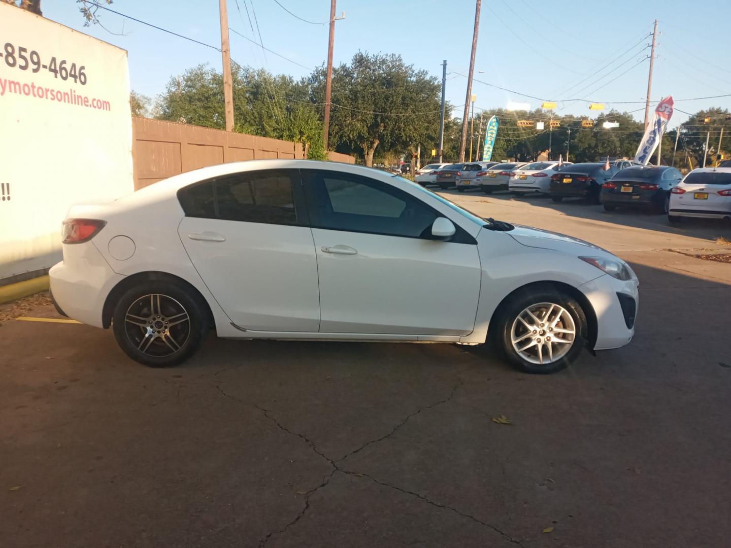 2011 /BLACK Mazda MAZDA3 i Sport 4-Door (JM1BL1UG5B1) with an 2.0L L4 DOHC 16V engine, located at 16710 Clay Rd., Houston, TX, 77084, (281) 859-7900, 29.834864, -95.656166 - Low Down. Low Payments. - Photo#1