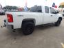 2012 White Chevrolet Silverado 1500 Work Truck Ext. Cab 4WD (1GCRKPEA6CZ) with an 4.8L V8 OHV 16V engine, 4-Speed Automatic transmission, located at 16710 Clay Rd., Houston, TX, 77084, (281) 859-7900, 29.834864, -95.656166 - Photo#5