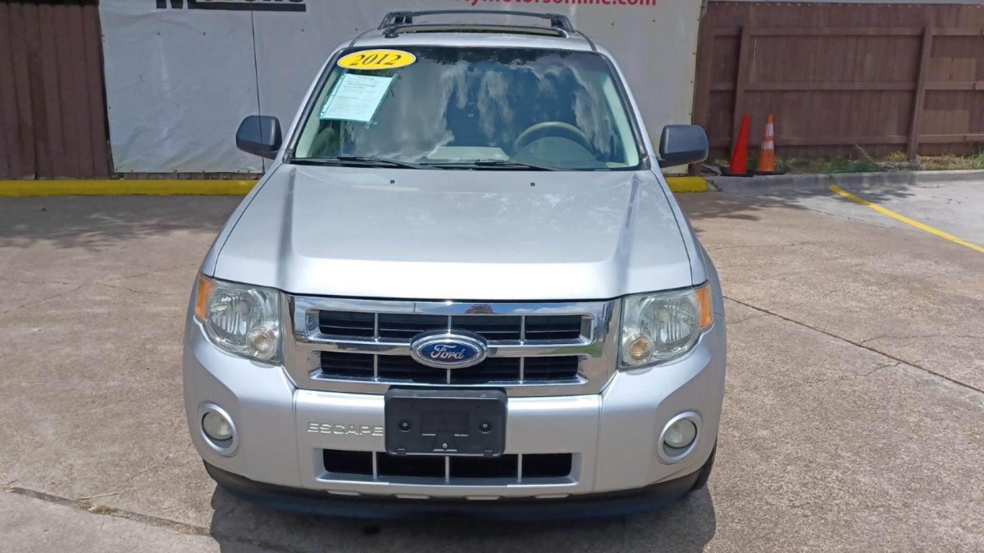 2012 Silver Ford Escape XLT FWD (1FMCU0D78CK) with an 2.5L L4 DOHC 16V engine, 6-Speed Automatic transmission, located at 16710 Clay Rd., Houston, TX, 77084, (281) 859-7900, 29.834864, -95.656166 - Low Down. Low Payments. - Photo#1