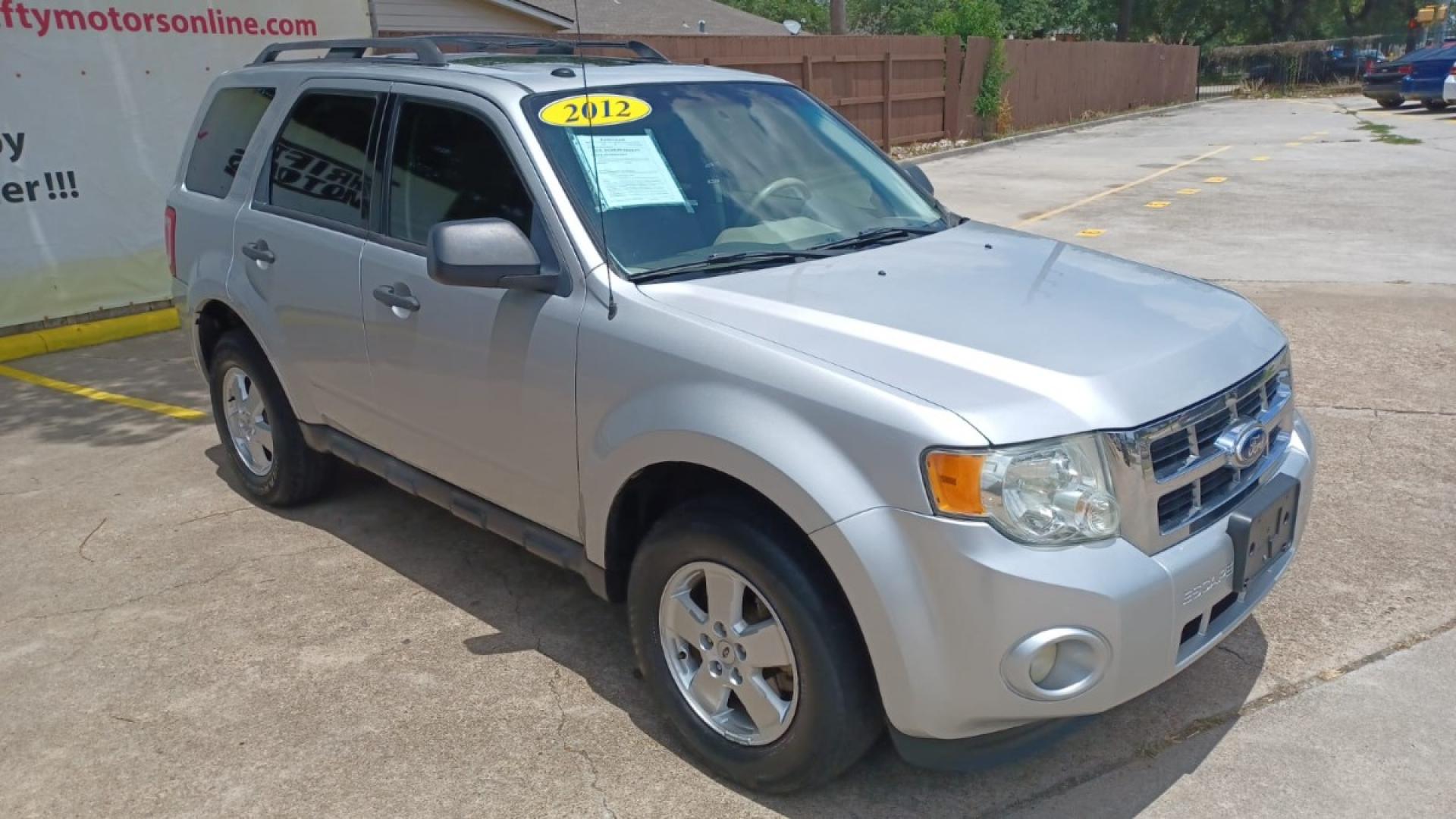 2012 Silver Ford Escape XLT FWD (1FMCU0D78CK) with an 2.5L L4 DOHC 16V engine, 6-Speed Automatic transmission, located at 16710 Clay Rd., Houston, TX, 77084, (281) 859-7900, 29.834864, -95.656166 - Low Down. Low Payments. - Photo#6