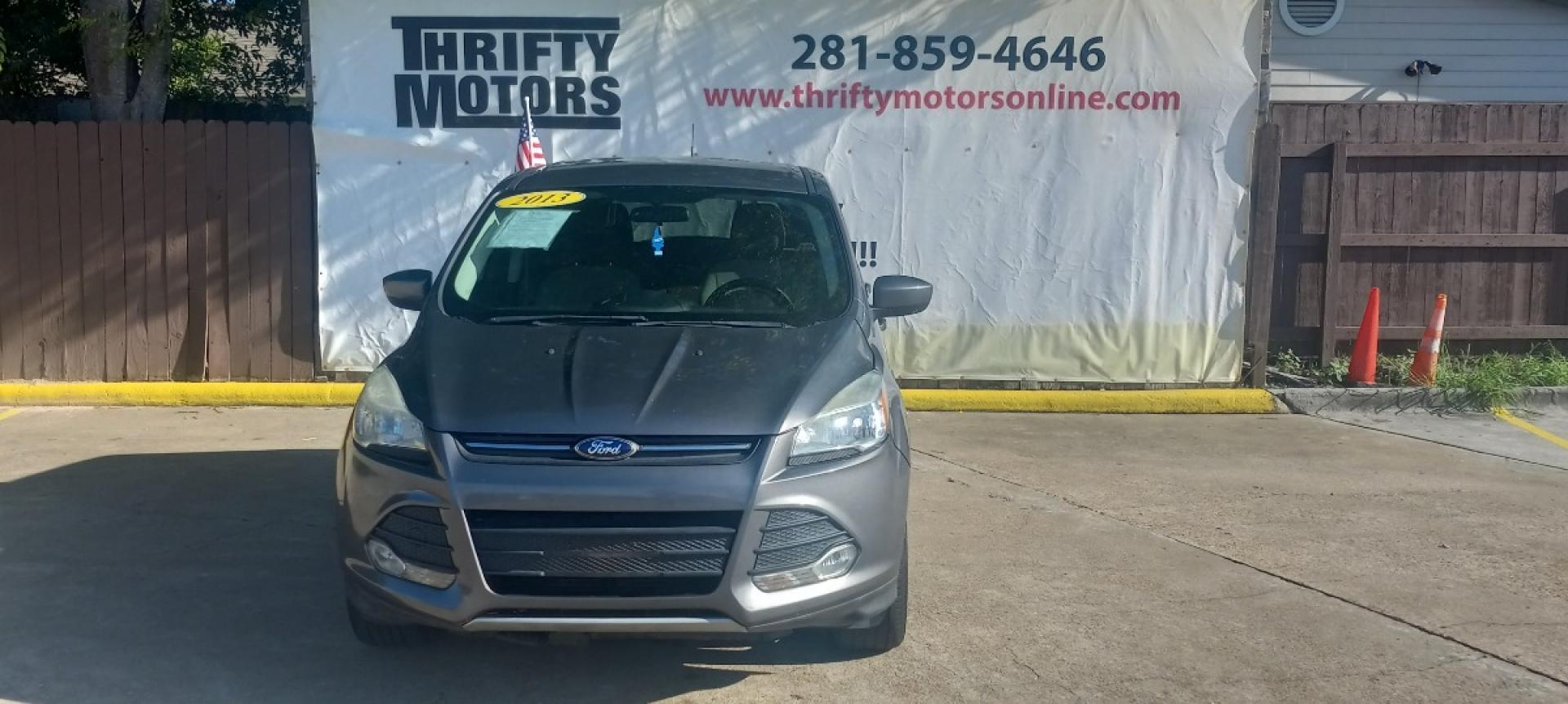 2013 Gray Ford Escape SE FWD (1FMCU0GX6DU) with an 1.6L L4 DOHC 16V engine, 6-Speed Automatic transmission, located at 16710 Clay Rd., Houston, TX, 77084, (281) 859-7900, 29.834864, -95.656166 - Low Down. Low Payments. - Photo#1