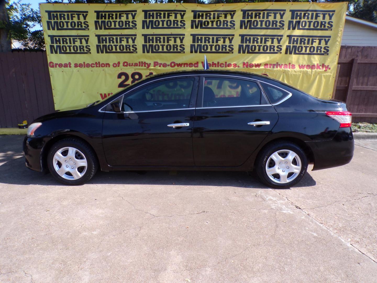 2015 Black Nissan Sentra (3N1AB7AP3DL) with an 1.8L I4 1.8L I4 engine, Manual 6-Speed transmission, located at 16710 Clay Rd., Houston, TX, 77084, (281) 859-7900, 29.834864, -95.656166 - Photo#0