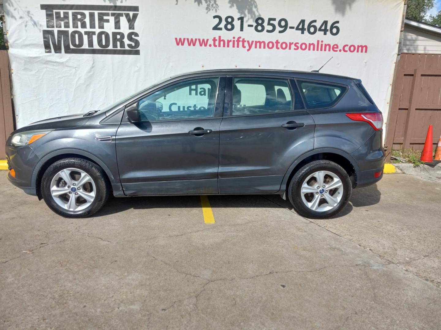 2015 Gray Ford Escape S FWD (1FMCU0F77FU) with an 2.5L L4 DOHC 16V engine, 6-Speed Automatic transmission, located at 16710 Clay Rd., Houston, TX, 77084, (281) 859-7900, 29.834864, -95.656166 - Low Down. Low Payments. - Photo#0