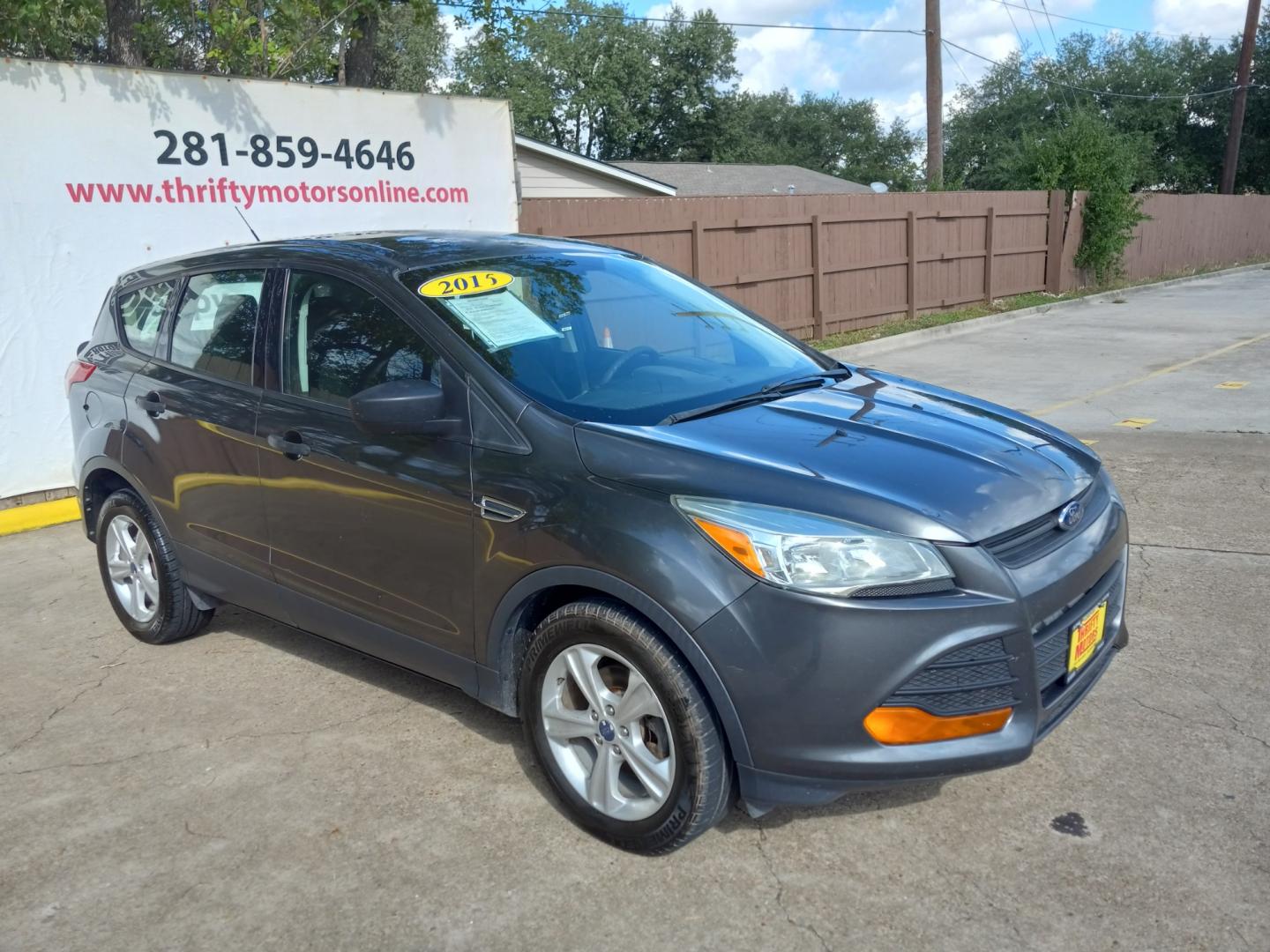 2015 Gray Ford Escape S FWD (1FMCU0F77FU) with an 2.5L L4 DOHC 16V engine, 6-Speed Automatic transmission, located at 16710 Clay Rd., Houston, TX, 77084, (281) 859-7900, 29.834864, -95.656166 - Low Down. Low Payments. - Photo#4