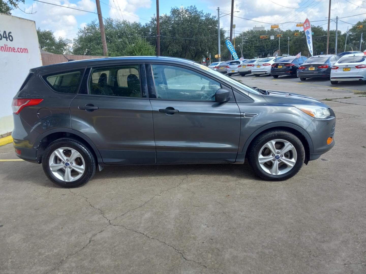 2015 Gray Ford Escape S FWD (1FMCU0F77FU) with an 2.5L L4 DOHC 16V engine, 6-Speed Automatic transmission, located at 16710 Clay Rd., Houston, TX, 77084, (281) 859-7900, 29.834864, -95.656166 - Low Down. Low Payments. - Photo#1