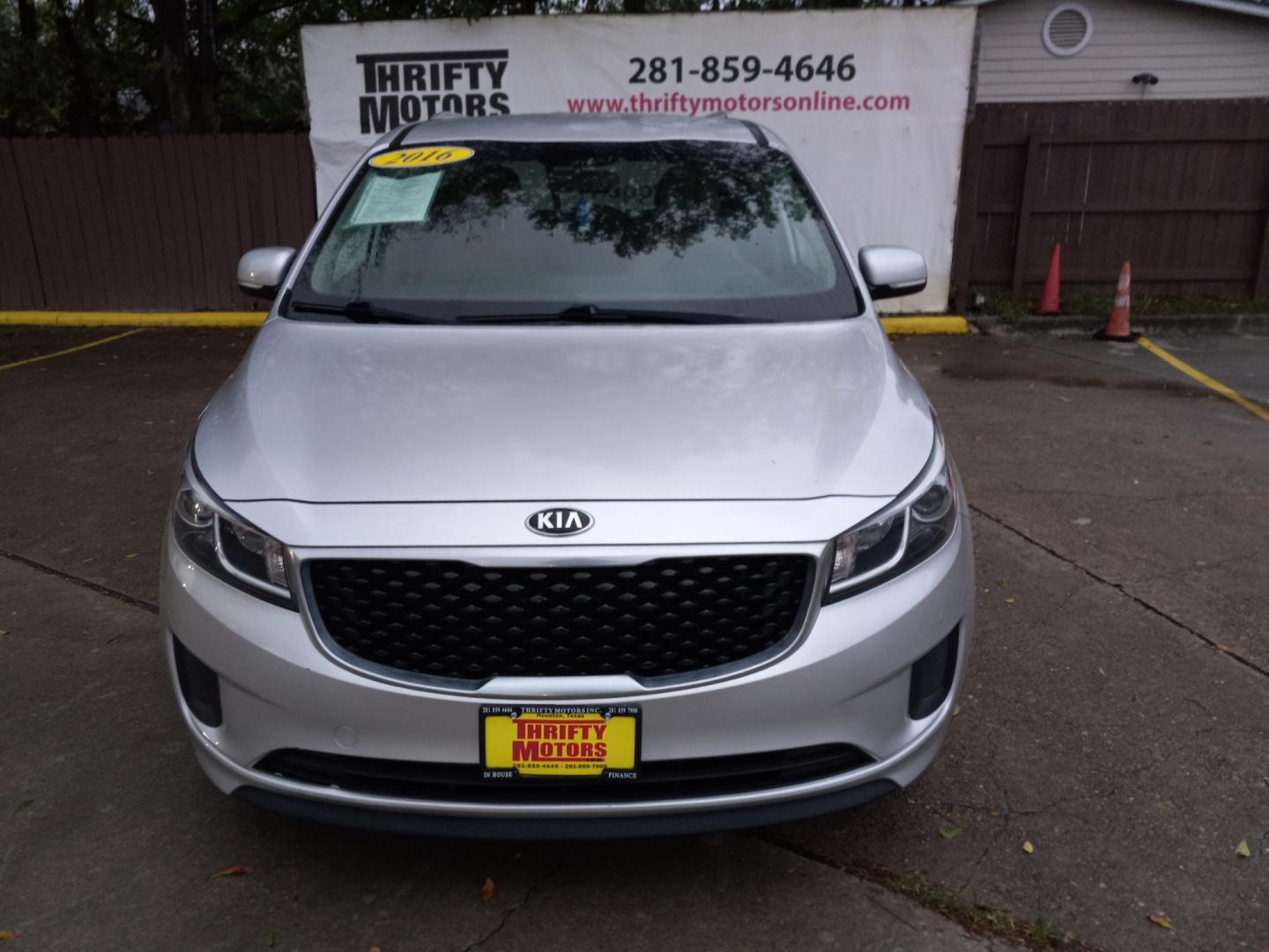 2016 Silver Kia Sedona LX (KNDMB5C12G6) with an 3.3L V6 DOHC 24V engine, 6-Speed Automatic transmission, located at 16710 Clay Rd., Houston, TX, 77084, (281) 859-7900, 29.834864, -95.656166 - Low Down. Low Payments. - Photo#1