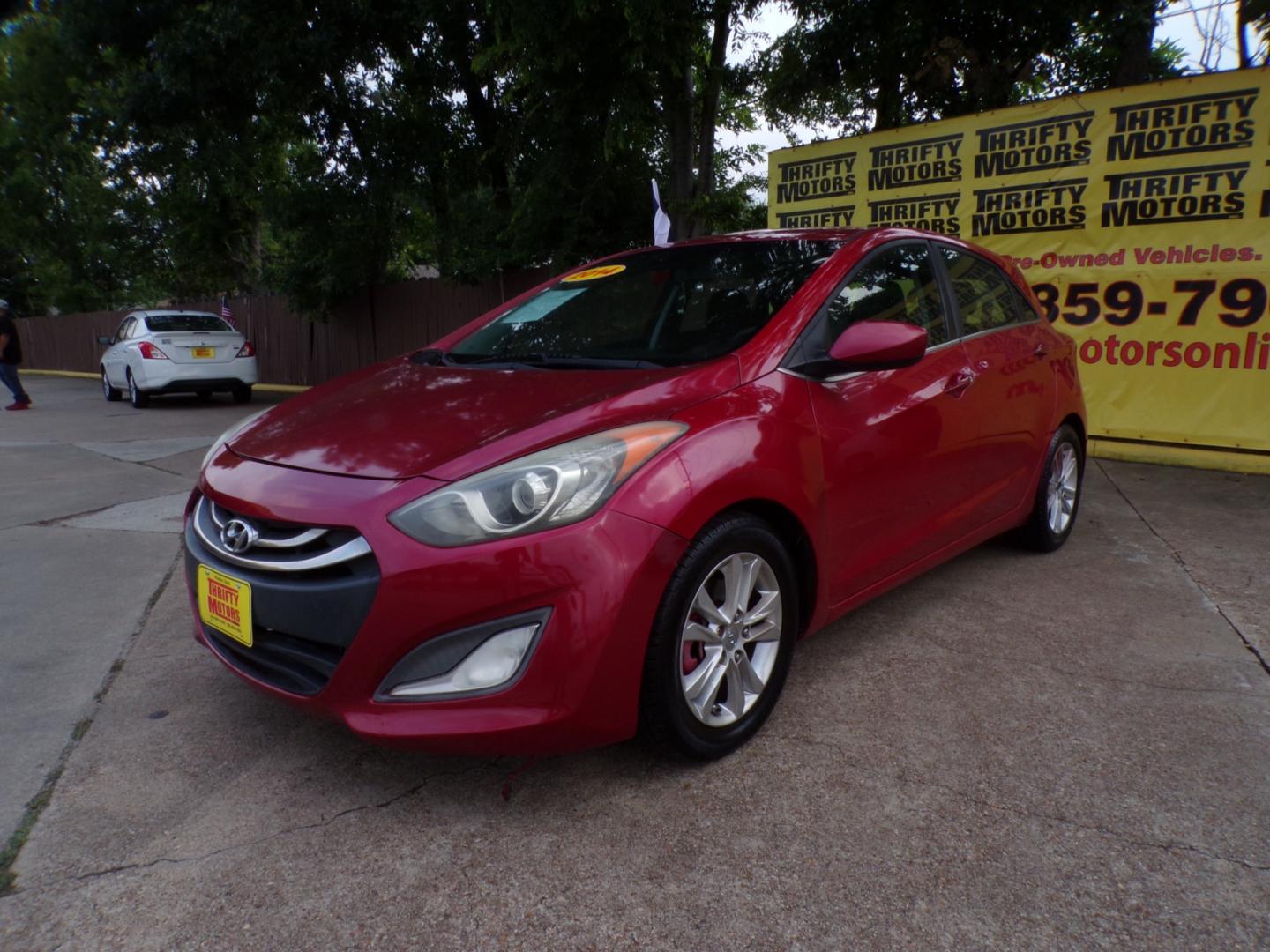 2014 Red Hyundai Elantra GT A/T (KMHD35LH7EU) with an 2.0L L4 16V DOHC engine, 6-Speed Automatic transmission, located at 16710 Clay Rd., Houston, TX, 77084, (281) 859-7900, 29.834864, -95.656166 - Low Down. Low Payments. - Photo#3