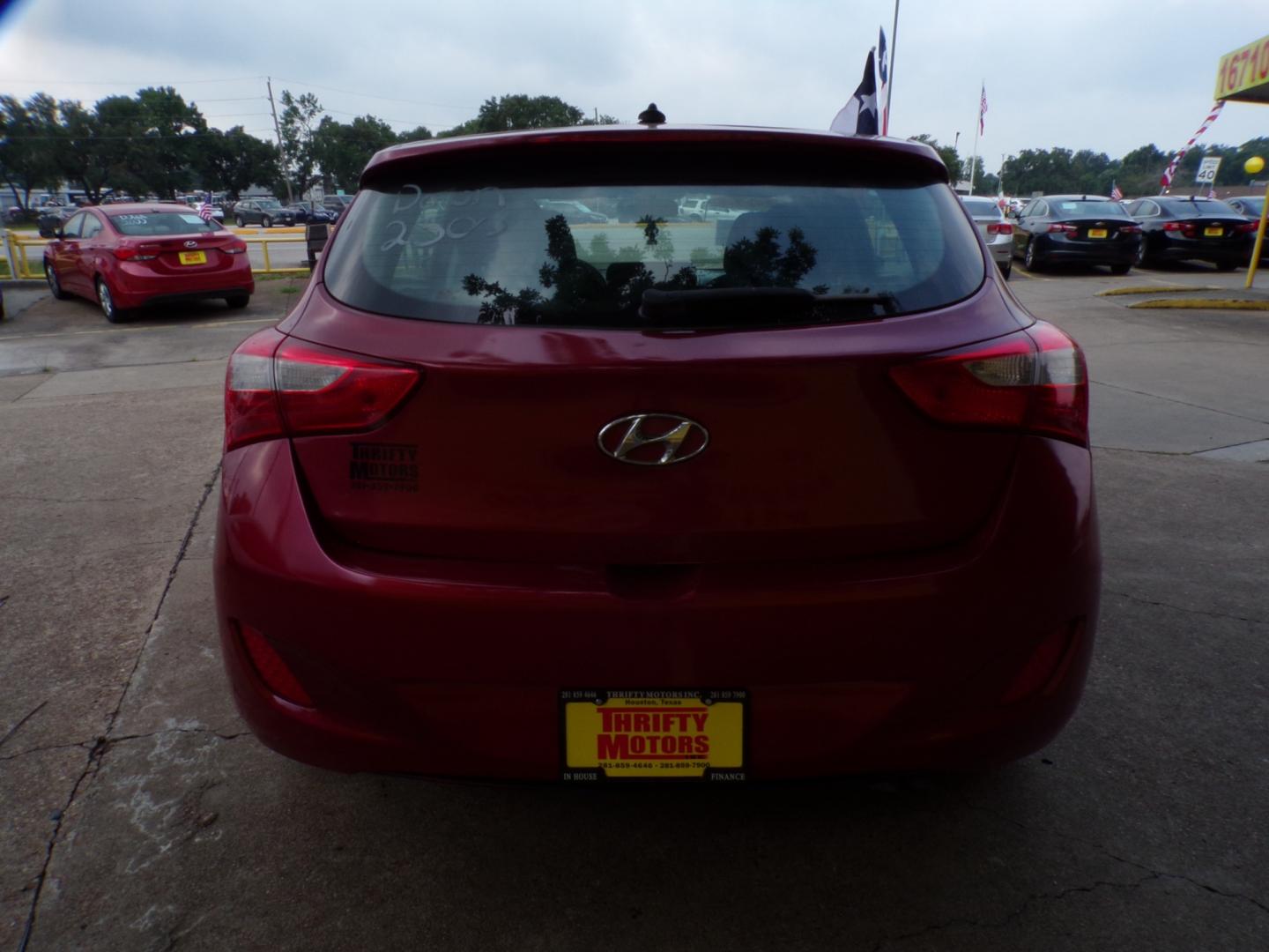 2014 Red Hyundai Elantra GT A/T (KMHD35LH7EU) with an 2.0L L4 16V DOHC engine, 6-Speed Automatic transmission, located at 16710 Clay Rd., Houston, TX, 77084, (281) 859-7900, 29.834864, -95.656166 - Low Down. Low Payments. - Photo#4